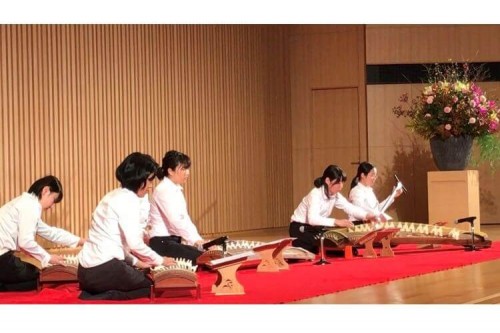 The art troupe of Nagoya University is performing Japanese traditional musical instrument, Koto